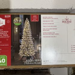 9 Foot Pre-Lit Flocked Christmas Tree (brand new in box)