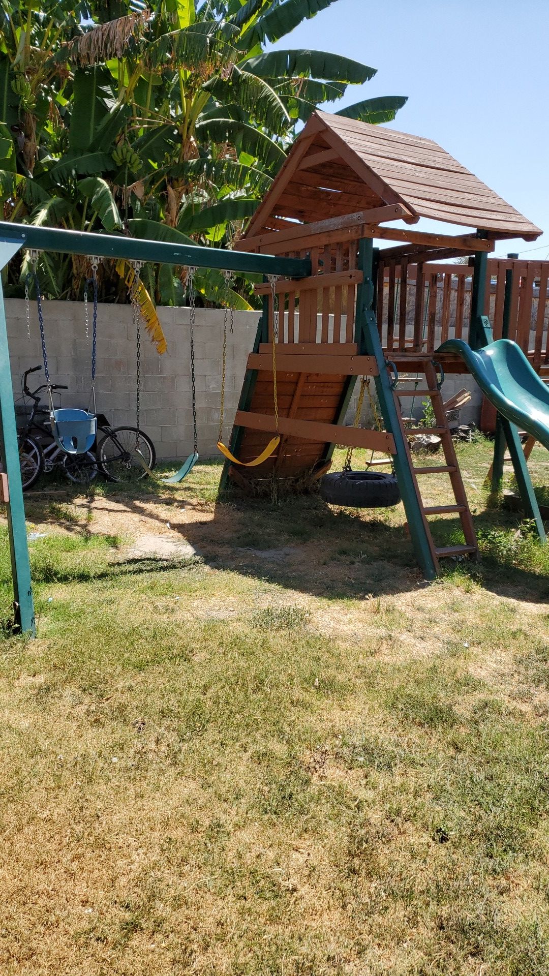 Playground slide and swing set.