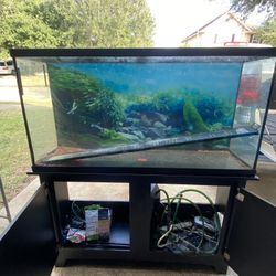 75 Gallon Fish tank + Stand, Water Pump, the whole setup works.