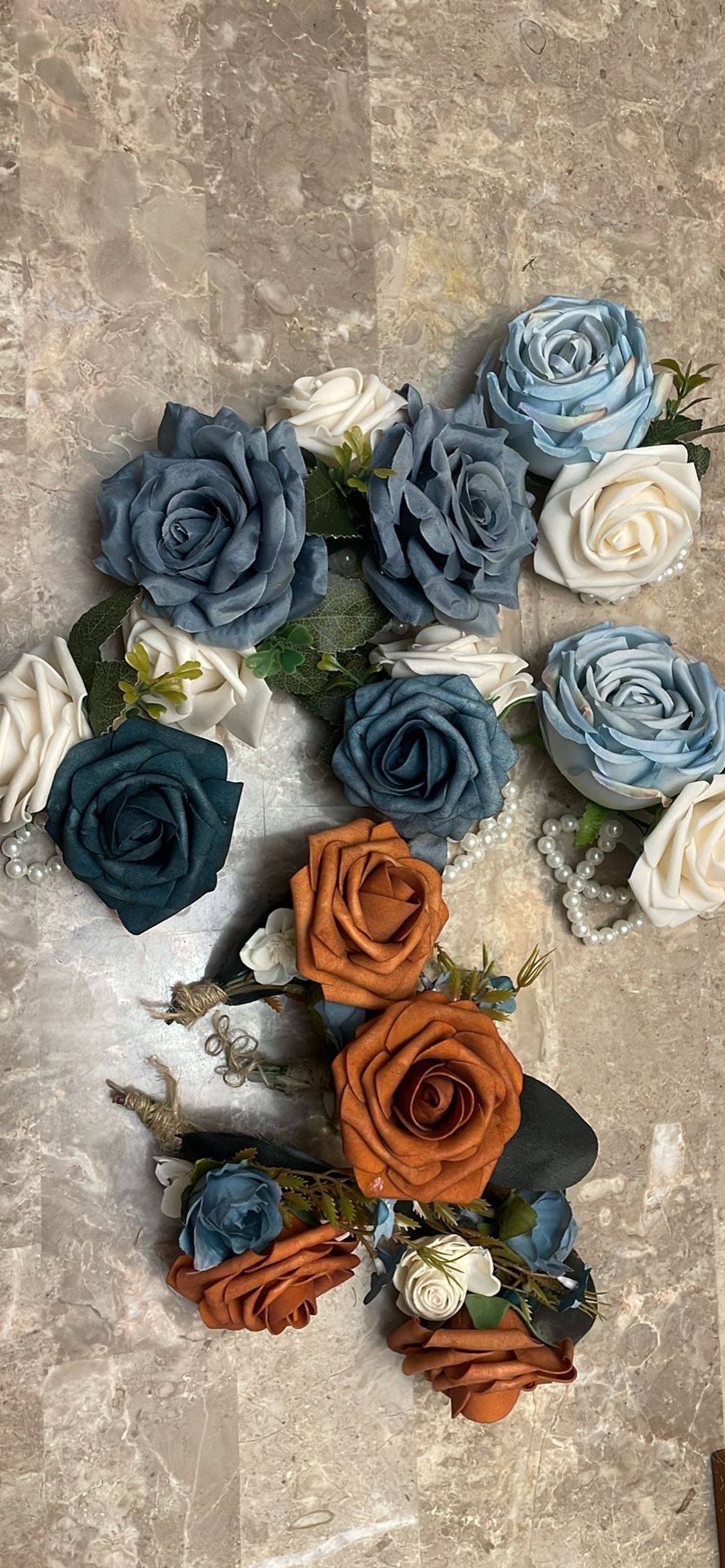 4 Boutonnières and 6 corsages Terra color/ burnt orange and ivory and blue hues.