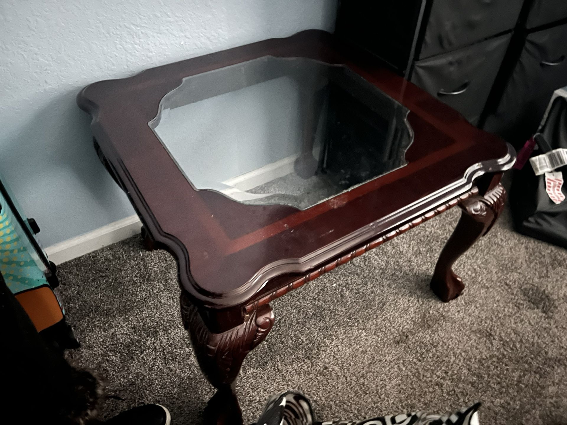 Solid wood coffee table with a glass top and cherry 
