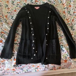 This Is A Crochet Black Sweater With Bedazzled Jewels On The Buttons And Sides