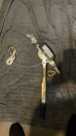 ratcheting cable puller, commonly known as a "come-along", which is a manual hand-operated winch used for pulling, lifting, and tensioning heavy loads