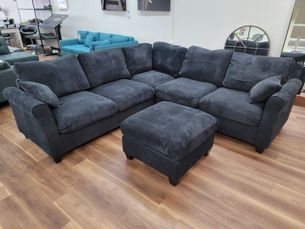 Brand New 4pc sectional and Ottoman In Balck Corduroy