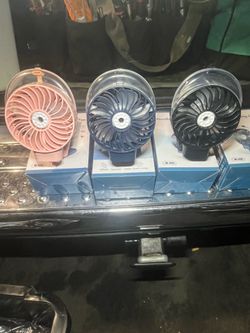 Mist spraying fans