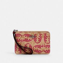 CORNER ZIP WRISTLET IN SIGNATURE CANVAS WITH REXY