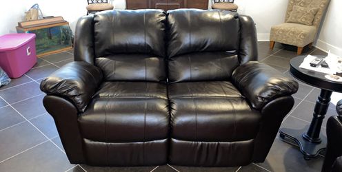 2 seat leather sofa with extended legs