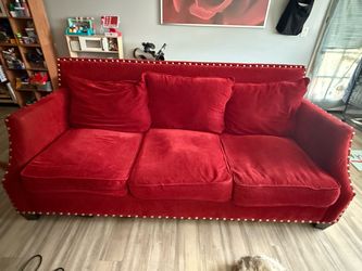 Red and gold accents couch