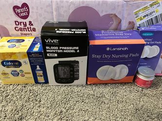 Nipple pads , nipple cream , & blood pressure machine