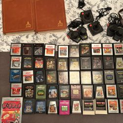 Lot Of 50 Atari 2600 Games - 2 binders - 2 Joysticks - 4 Paddles