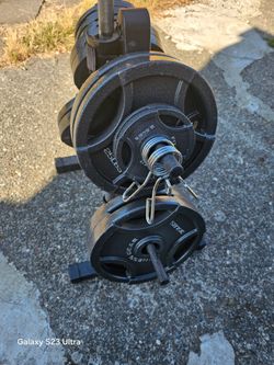 Olympic Weights Set With Barbell and weight Three