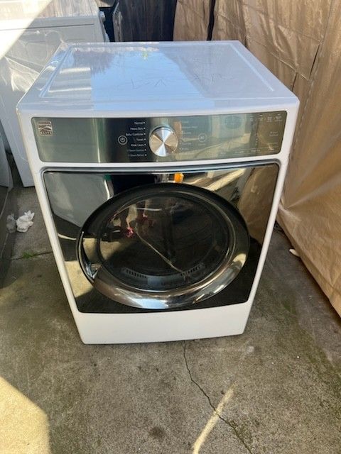 Kenmore dryer semi-new front load electric 220 volts capacity 7•5 with 3 months warranty free delivery in the Oakland area outside the Oakland area th