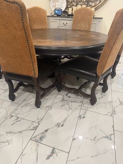 Big Table , beautiful , dining set with 6 leather  chairs, the table measures  71 inches wide  and  H 31 1/2