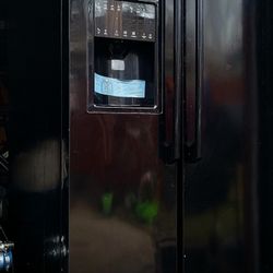 Black Elextrolux Refrigerator & Electric Stove