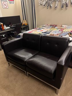 Black leather love seat