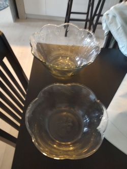 Two pretty glass bowls large 14inches wide Small 11 1/2 inches like new