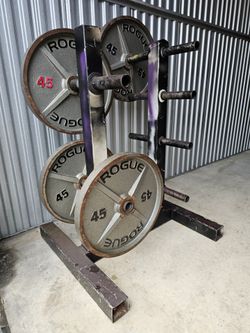 4 Rogue 45LB Machined Olympic Weight Plates. Homestead 33033. Delivery fee.

Heavy-duty cast-iron Rogue 45lb machined Olympic weight plates come in a 