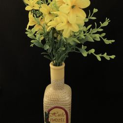 Huile Pimentee Decorative bottle/vase with artificial yellow flowers