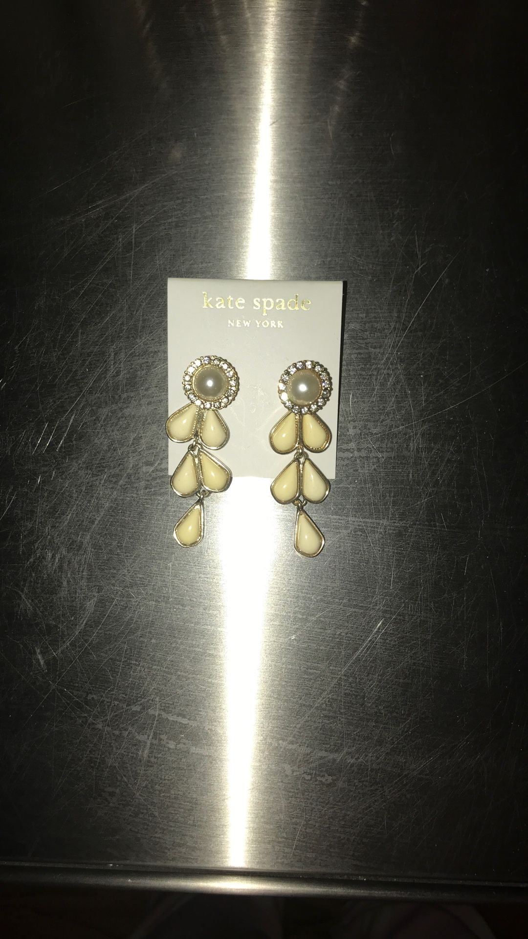 Kate Spade 2 inch white acrylic and surgical steel 2 inch chandelier earrings