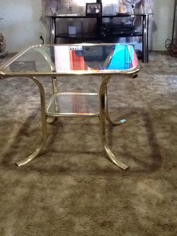 Brass , glass coffee table.