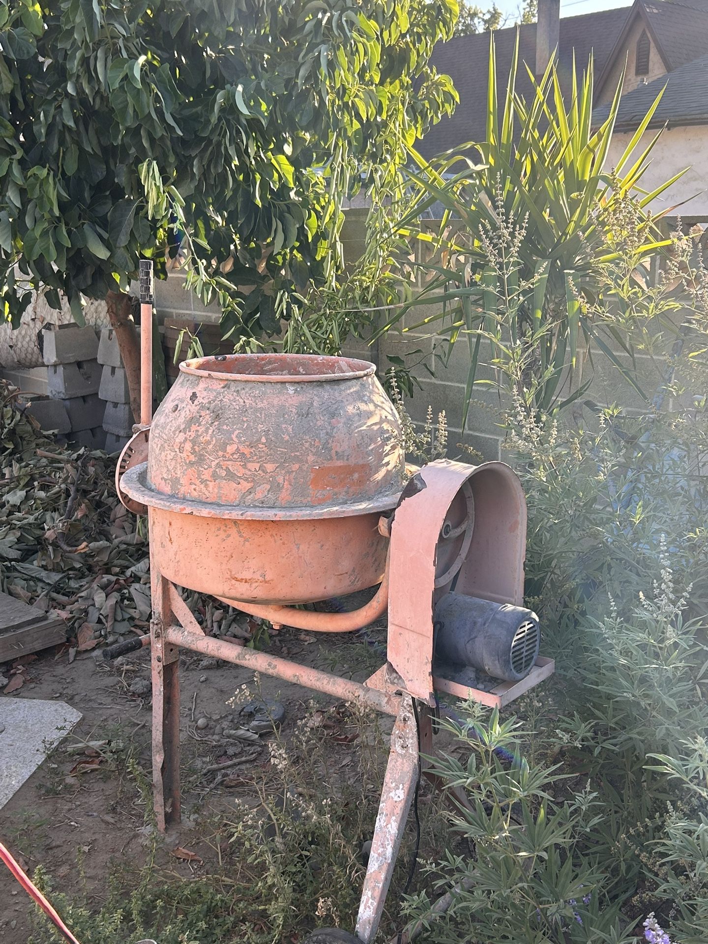 concrete mixer, also known as a cement mixer.