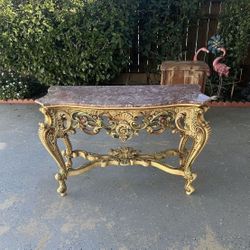 This is a Louis XV style console table with a rouge or Lumachella di Frascati marble top measures W 47"-H 31.5-D 20"inches