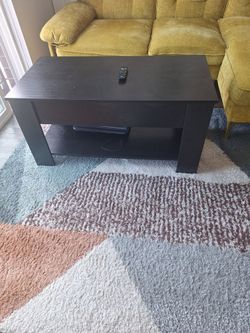 Coffee table with lift top