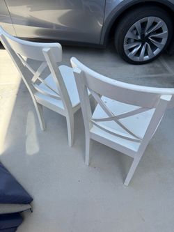 2 white chairs Used