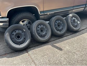 Set of 4 15" Steel Wheels w/ 195/60R15 Studded Winter Tires (4-Lug)
