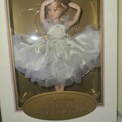Lot of porcelain dolls I believe there's 5 or 6 all new in the Box