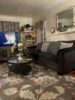 Sofa, grey with 7 cushions.