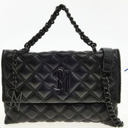 This Steve Madden shoulder bag showcases a luxurious quilted design in sleek black, complete with a stylish chain strap. Crafted for elegance,