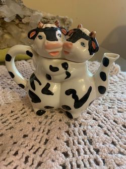 Vintage two cow hugging porcel creamer dish