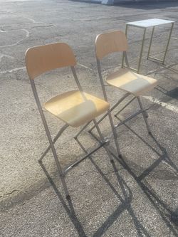 Two folding bar stools