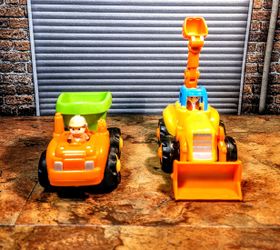 2- Lot Huile Trucks • Both Friction Powered , Push & Go • 1 - Bull Dozer & 1-Dump • Both Have Movable Parts • 

