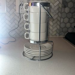 Four cup  and saucer  set with holder