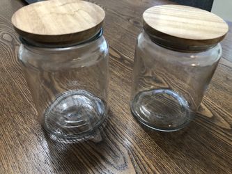 Brand new glass jars with wood lids