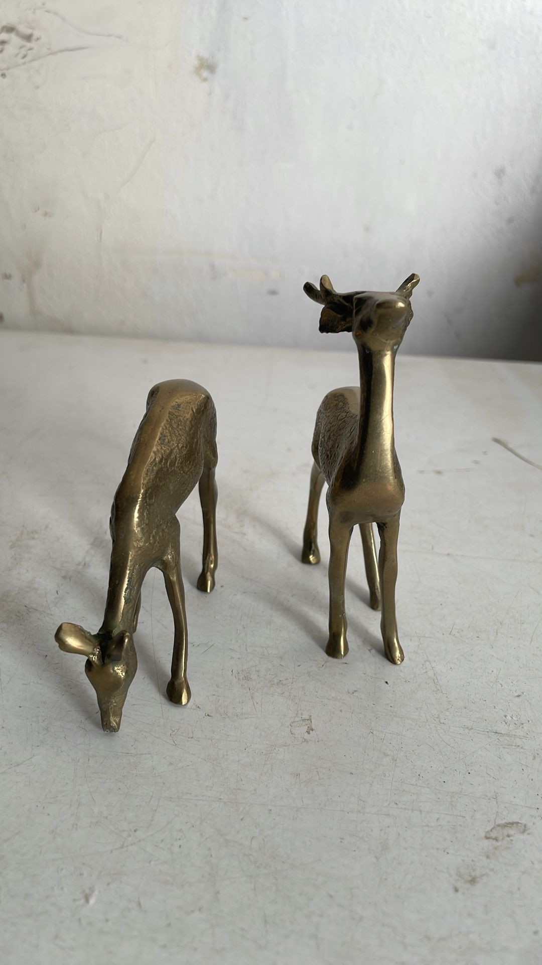 Two brass deer
