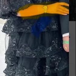 Long, black, party dress with sequins and black net around it beautiful party dress