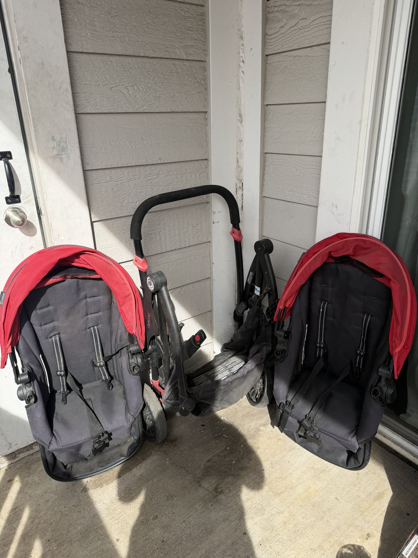 Double Stroller With Red Canopy