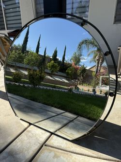 Round mirror with metal border frame