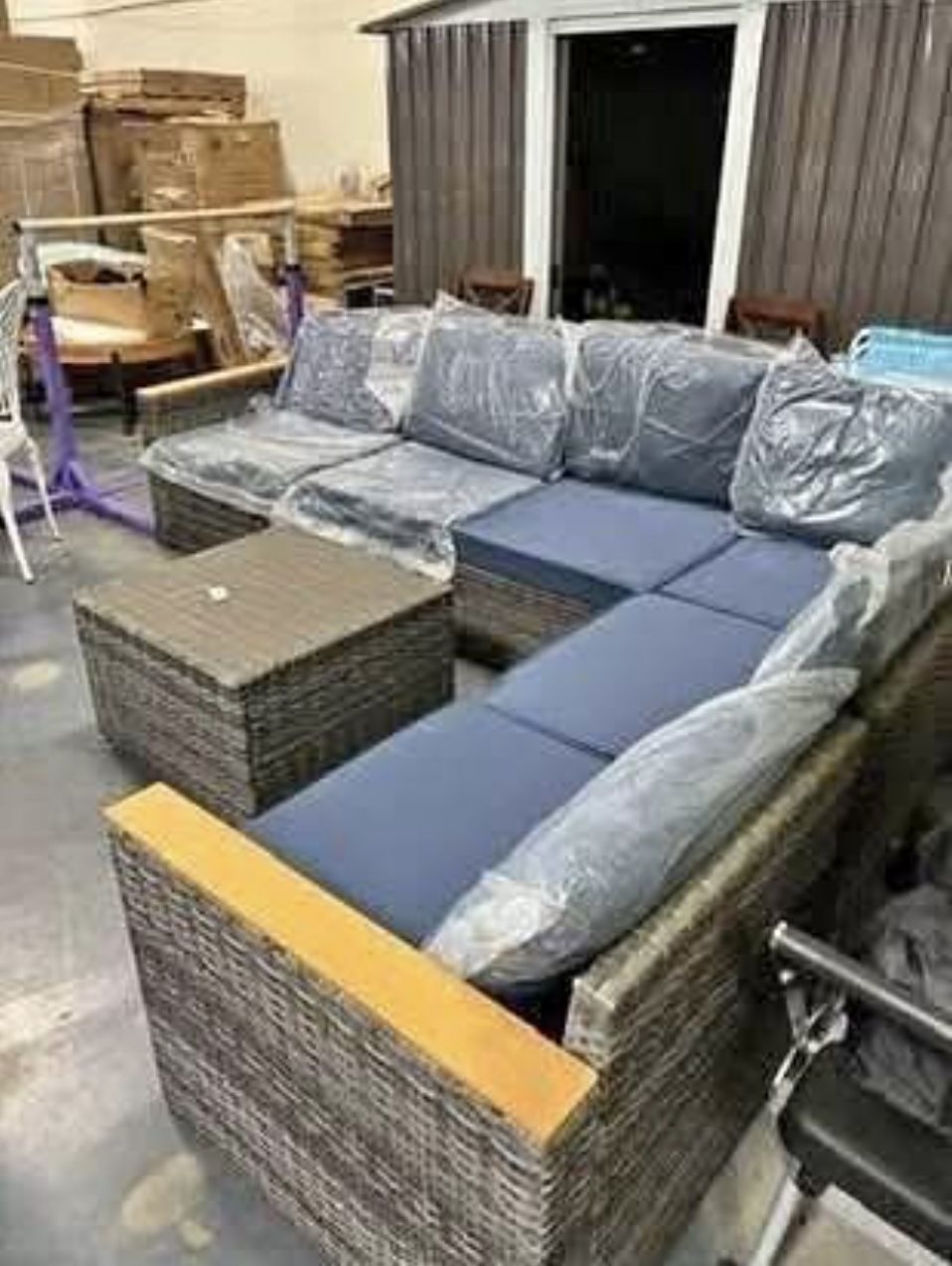 AS IS 1 cushion is Darker 7 pc outdoor patio furniture w/ blue cushions & grey wicker DELIVERY W/FEE