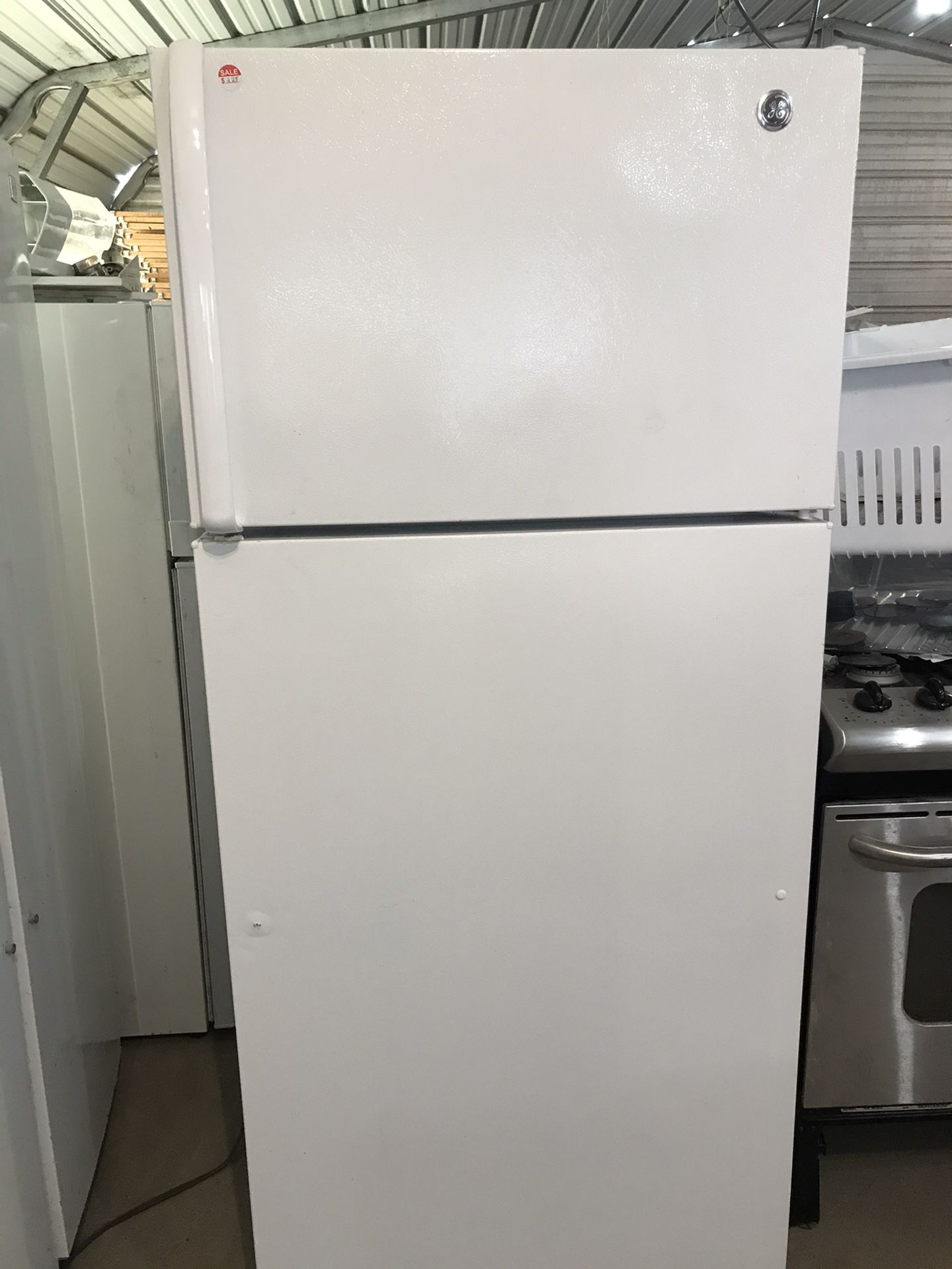 GE Top freezer and bottom refrigerator white color working condition with warranty delivery available call or visit for more information