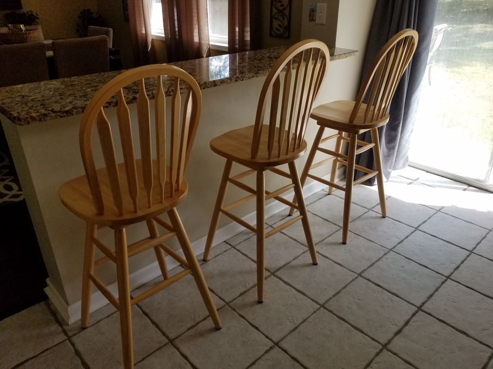 3 counter/bar stools, solid wood, excellent condition, 29" floor to seat, 360 swivel, high back.