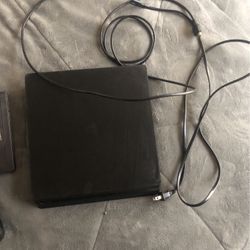 Ps4 with cords, games, and controller 