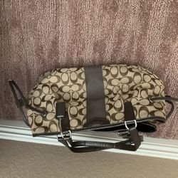 Brown   coach purse Three big compartments  To Put stuff in Naver  Used 