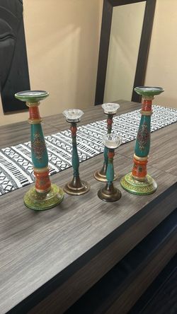 five candlesticks 2 of which are from world market