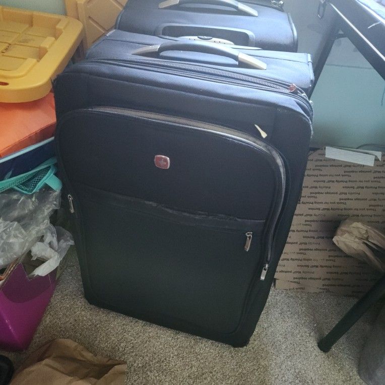 2 swiss gear luggages. used