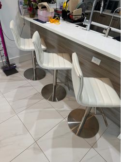 3 white bar chairs