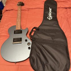 Guitar W/ Stand And Amp